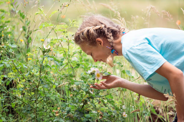 istock A young beautiful girl playing in the forest 1274959115