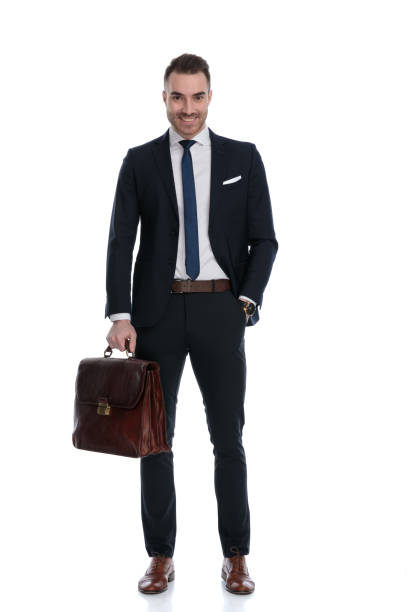 istock Cheerful businessman laughing and holding briefcase 1274959966