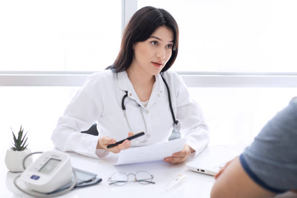 istock Beautiful female doctor consulting patient 1274965111