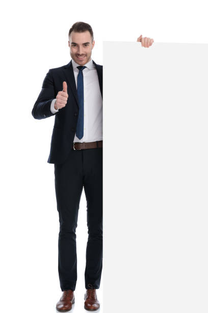 istock Positive businessman gesturing ok and holding empty billboard 1274974587
