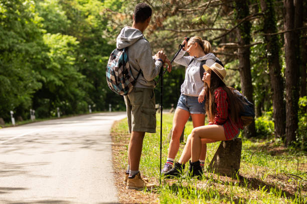 istock Group of hikers taking a break after long walk in nature. 1274978037