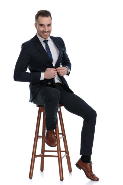 istock Positive businessman laughing and adjusting his jacket while sitting 1274978624