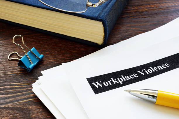 Workplace violence report papers and pen. stock photo