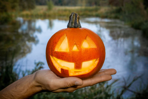 istock Pumpkin with a carved face. 1274989450