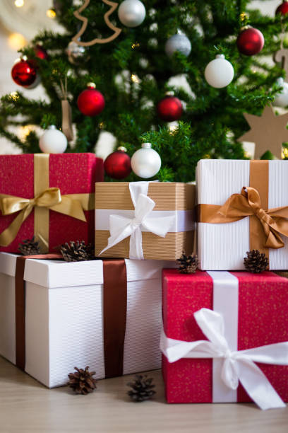 istock christmas background - decorated christmas tree and gifts 1274989482