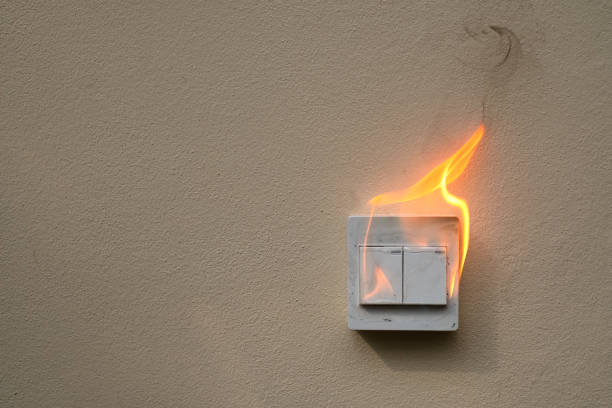 istock On fire electric switch  shock on the concrete wall caused by a short circuit 1274999672