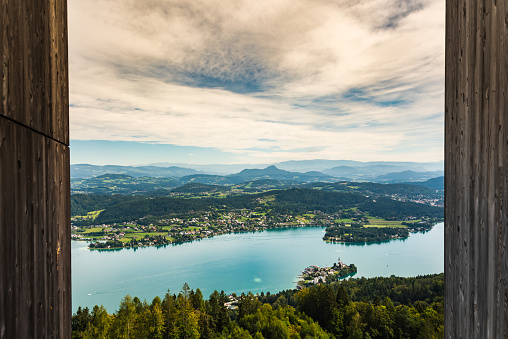 View at Lake Worthersee and Klagenfurt city from pyramidenkogel tower. Travel destination in Austria