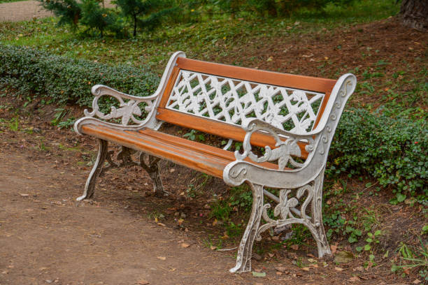 istock Bench in the middle of the forest 1275001434