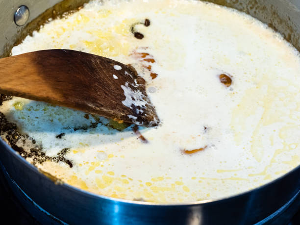 istock melted sugar and butter with added cream in pan 1275003381