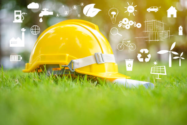 istock Yellow helmet on green with ecological icon 1275007497