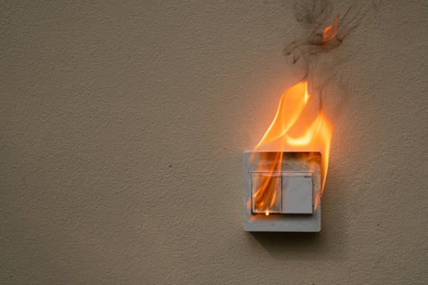 istock On fire electric switch  shock on the concrete wall caused by a short circuit 1275009811