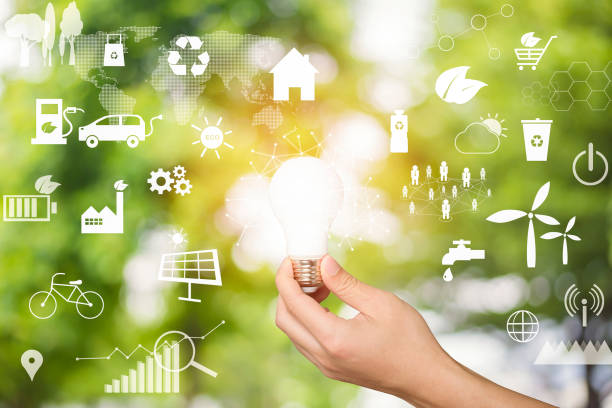 istock Human hand is holding light bulb on green, save earth concept. 1275020390
