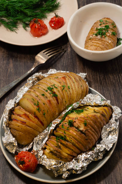 istock Baked potatoes on a peasant in foil 1275034558