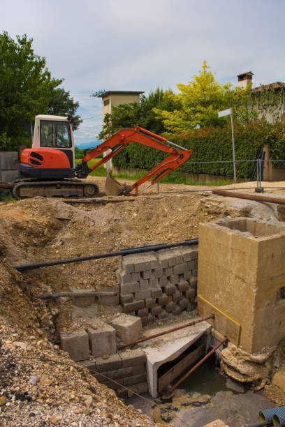 istock Sewer Well and Compact Crawler Excavator 1275039497