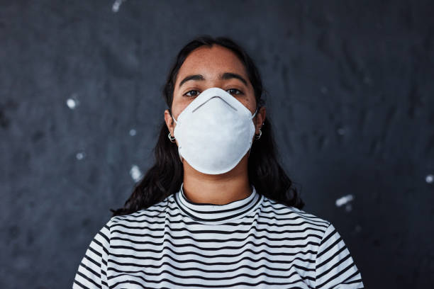 Until it's solved, society will slowly suffocate Studio shot of a young woman wearing a mask with “I can’t breathe” in protest against racism i cant breathe photos stock pictures, royalty-free photos & images