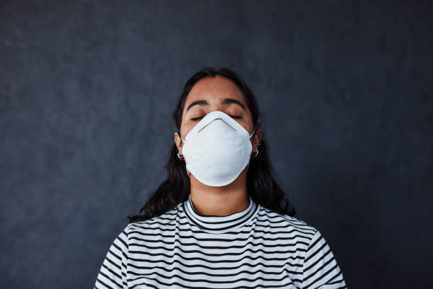 One life is one too many Studio shot of a young woman wearing a mask with “I can’t breathe” in protest against racism i cant breathe photos stock pictures, royalty-free photos & images