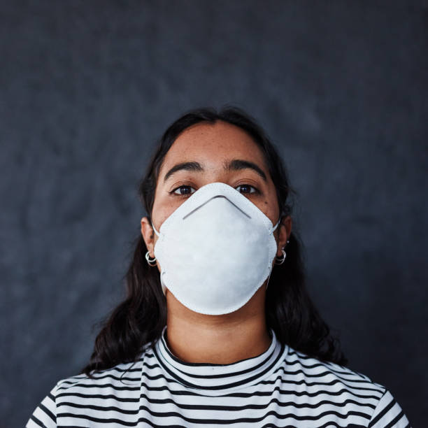 Will my life be cut short too? Studio shot of a young woman wearing a mask with “I can’t breathe” in protest against racism i cant breathe photos stock pictures, royalty-free photos & images