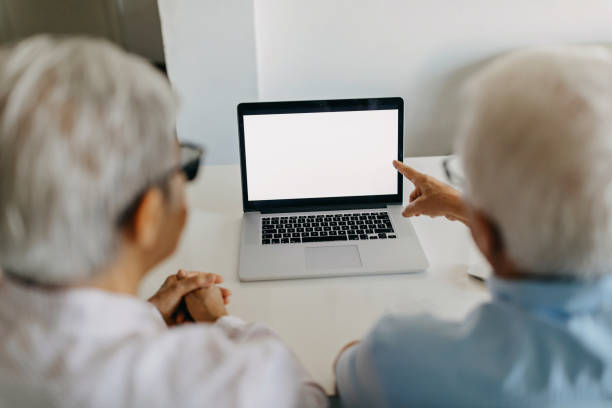 istock Senior couple on video call 1275071690