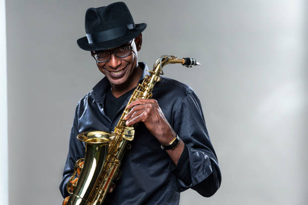 istock Musician with saxophone and big smile 1275080898