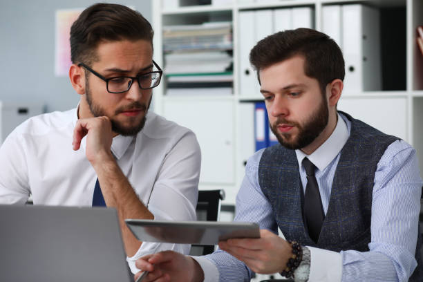 istock Concentrated office workers listening to online conference 1275081546