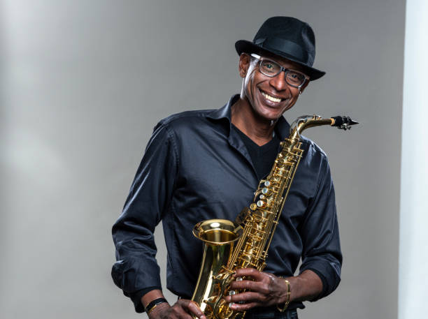 istock Musician with saxophone and big smile 1275081750