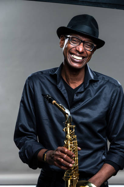 istock Musician with saxophone and big smile 1275082155