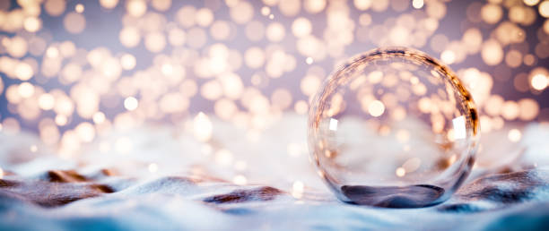istock Christmas glass ball on snow. Glitter lights 1275082870