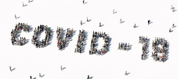 istock Large group of people shaping a Covid-19 word. 1275104352
