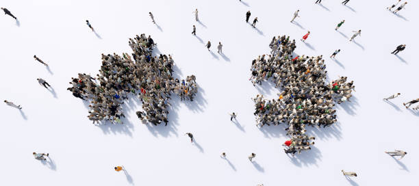 istock Two groups of people shaped in puzzle pieces joining together. 1275104623