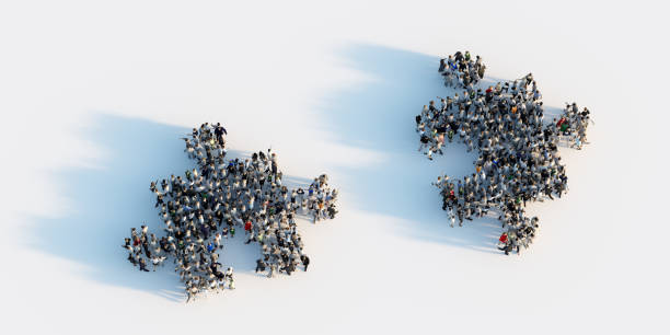 istock Two groups of people shaped in puzzle pieces joining together. 1275104639