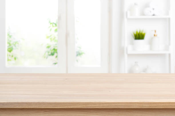 istock Defocused bathroom window background with empty tabletop for product display 1275135116