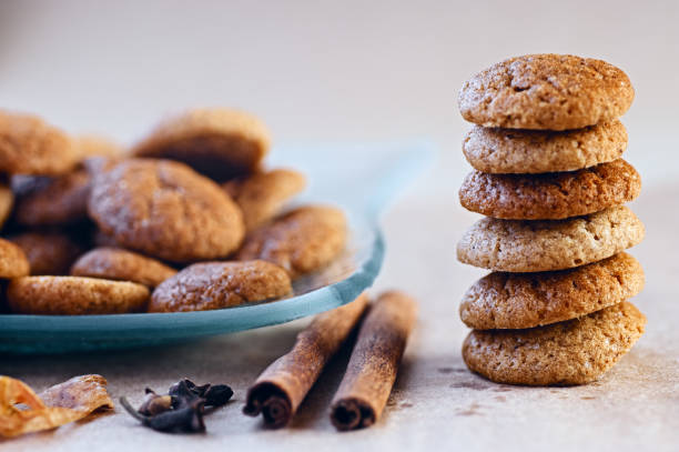 istock Baked spicy ginger bread sweet cookies with cloves and cinnamon sticks in stack 1275135119
