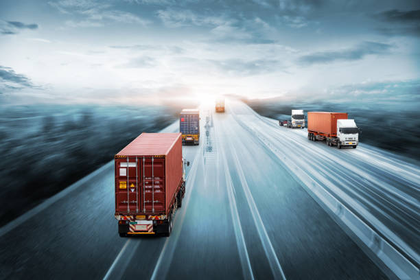 istock Truck transport with red container on highway road at sunset, motion blur effect, logistics import export background and cargo transport industry concept 1275144329