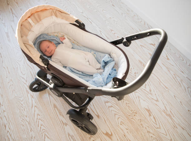 istock A little newborn baby lying in a baby stroller 1275156703