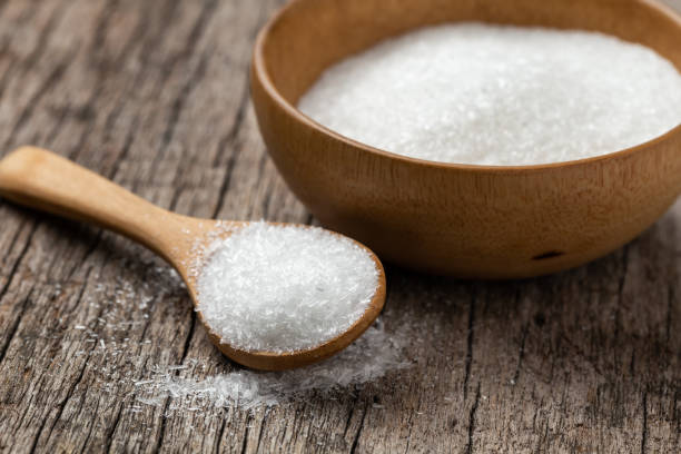 monosodium glutamate, MSG on wooden spoon