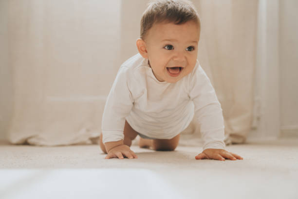 istock Baby crawling for the first time 1275174959
