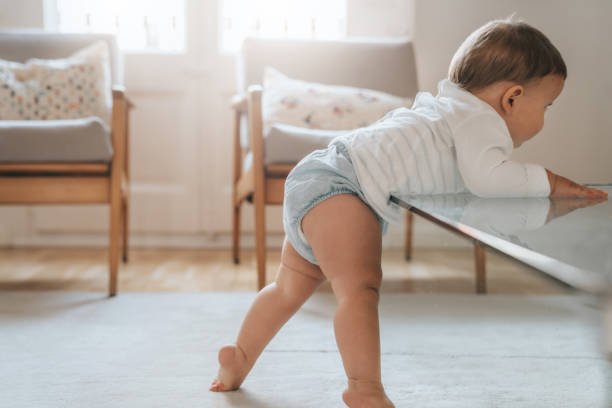 istock Baby standing up for the first time 1275175005