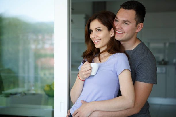 istock Happy young couple spending time together at home 1275176253