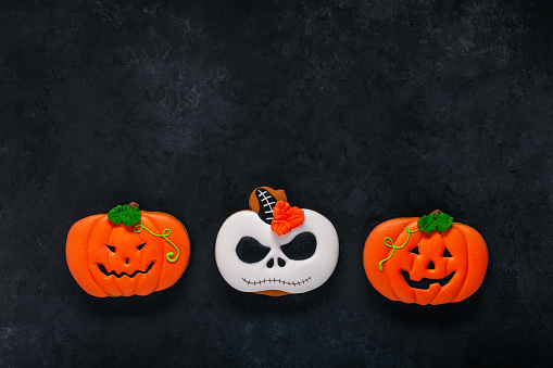Halloween Cookies on a black background. Copy space.