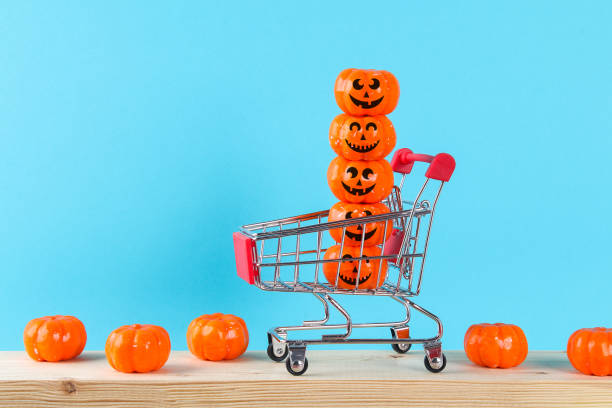 istock Halloween holiday concept with pumpkin decor on wooden table. 1275196770