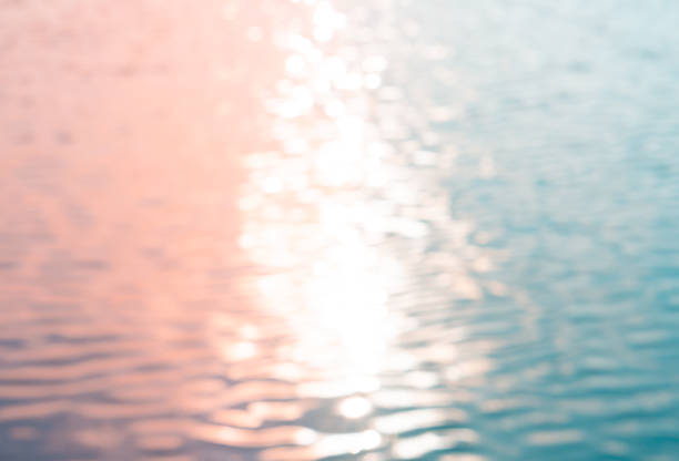 istock Colorful pink and blue defocused water surface 1275224970