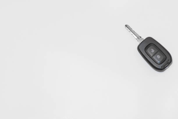 closeup of an isolated car and house keys kept on a marble floor with blurry city background closeup of an isolated car and house keys kept on a marble floor with blurry city background car keys table stock pictures, royalty-free photos & images