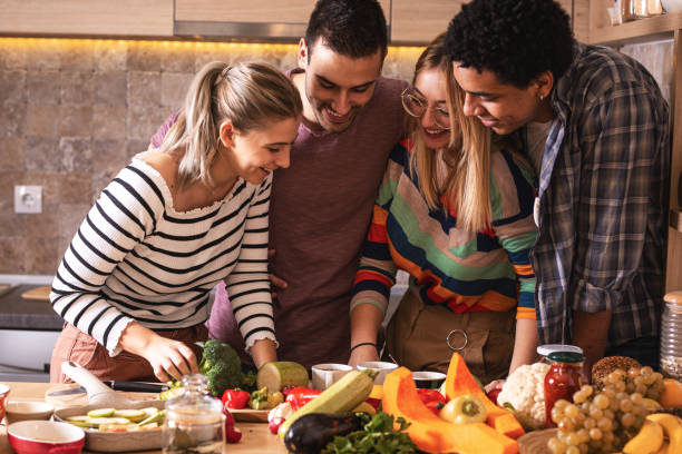 istock Group of friends preparing vegetarian meal. 1275226746