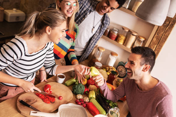 istock Group of friends preparing vegetarian meal. 1275227063