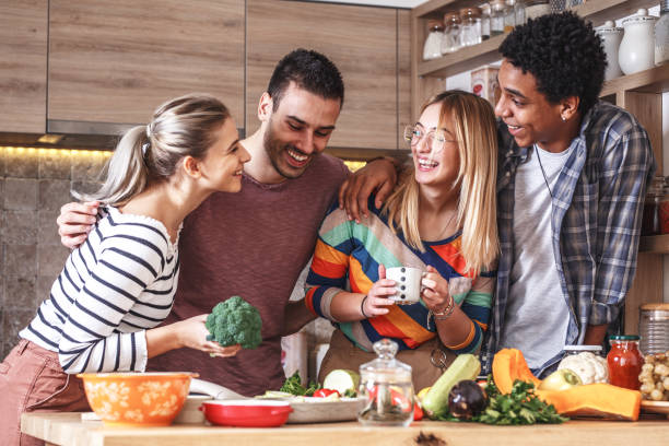 istock Group of friends preparing vegetarian meal. 1275227614