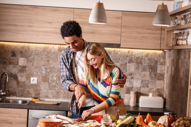 istock Young couple preparing vegetarian meal. 1275227618