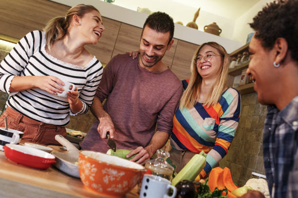 istock Group of friends preparing vegetarian meal. 1275228332