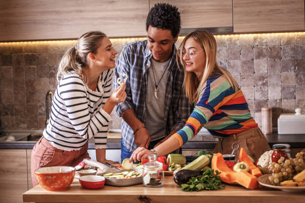 istock Group of friends preparing vegetarian meal. 1275230227