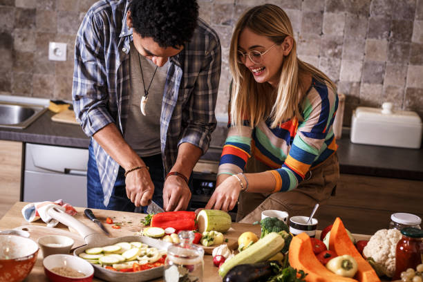 istock Young couple preparing vegetarian meal. 1275232597