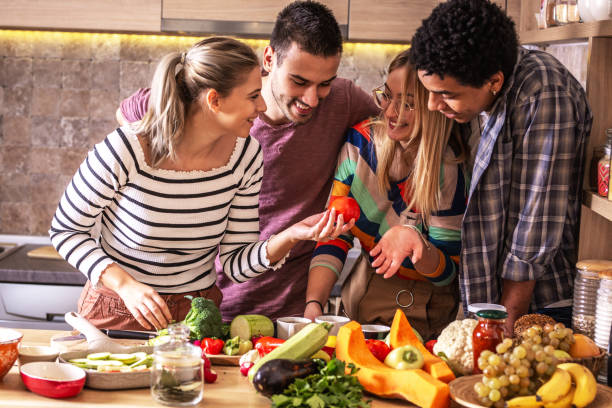 istock Group of friends preparing vegetarian meal. 1275234295